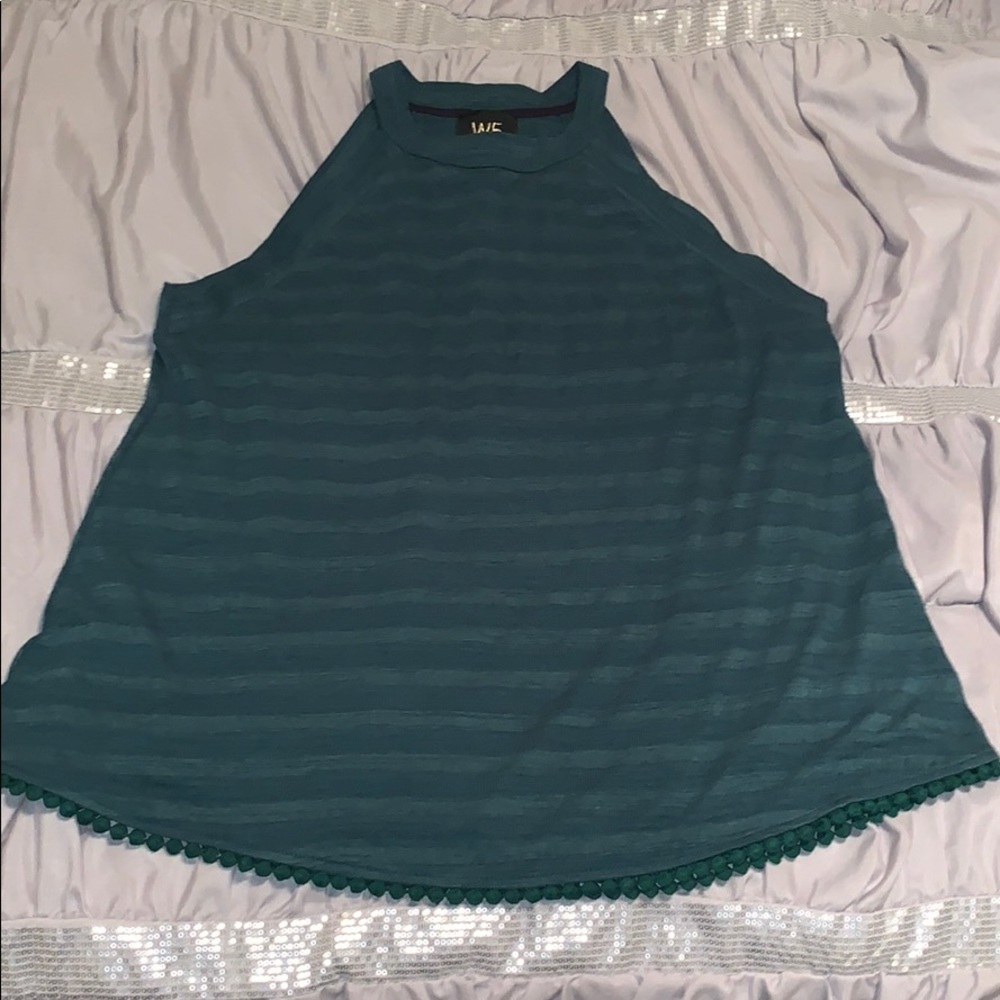 High neck tank with hem detail.